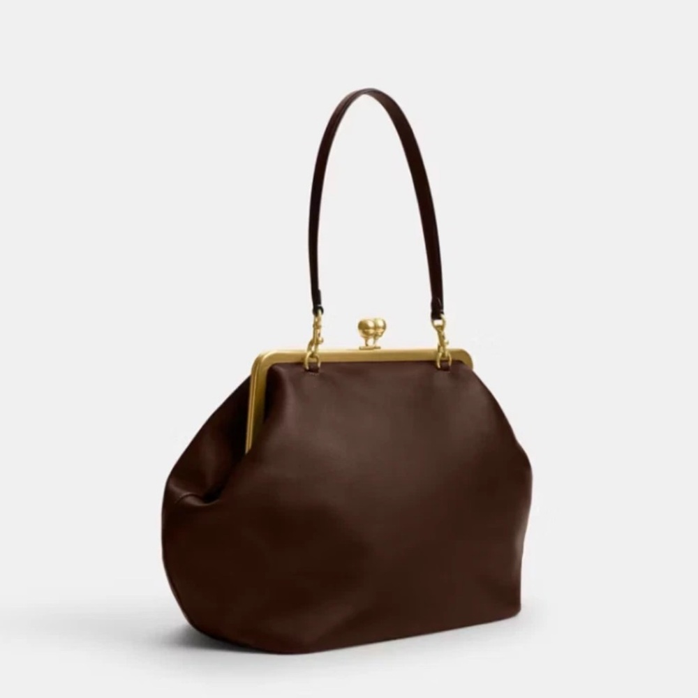 Coach Kisslock!!! Hottest bag of the season!